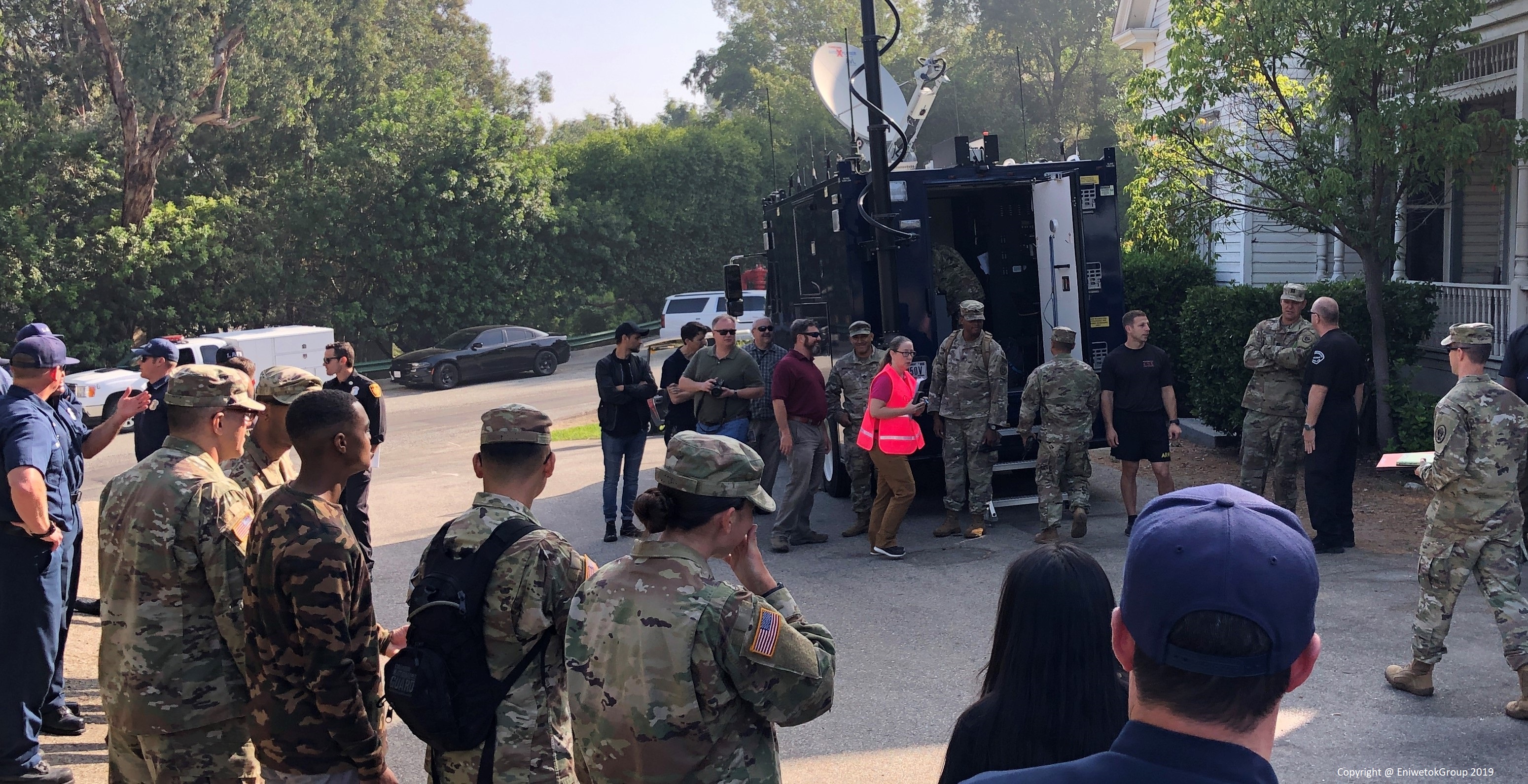 Field team assembled around a mobile command vehicle